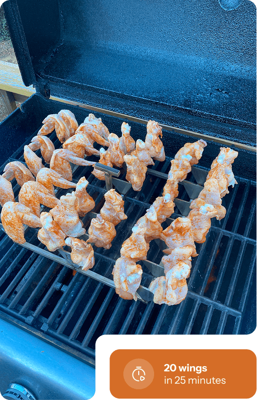 Cooking rack with wings placed on grill grates